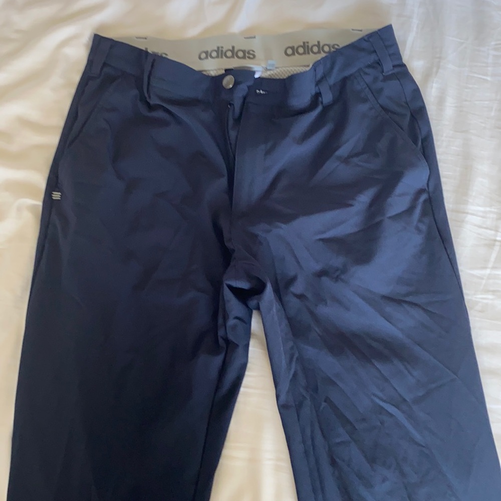 Navy blue Adidas golf pants.